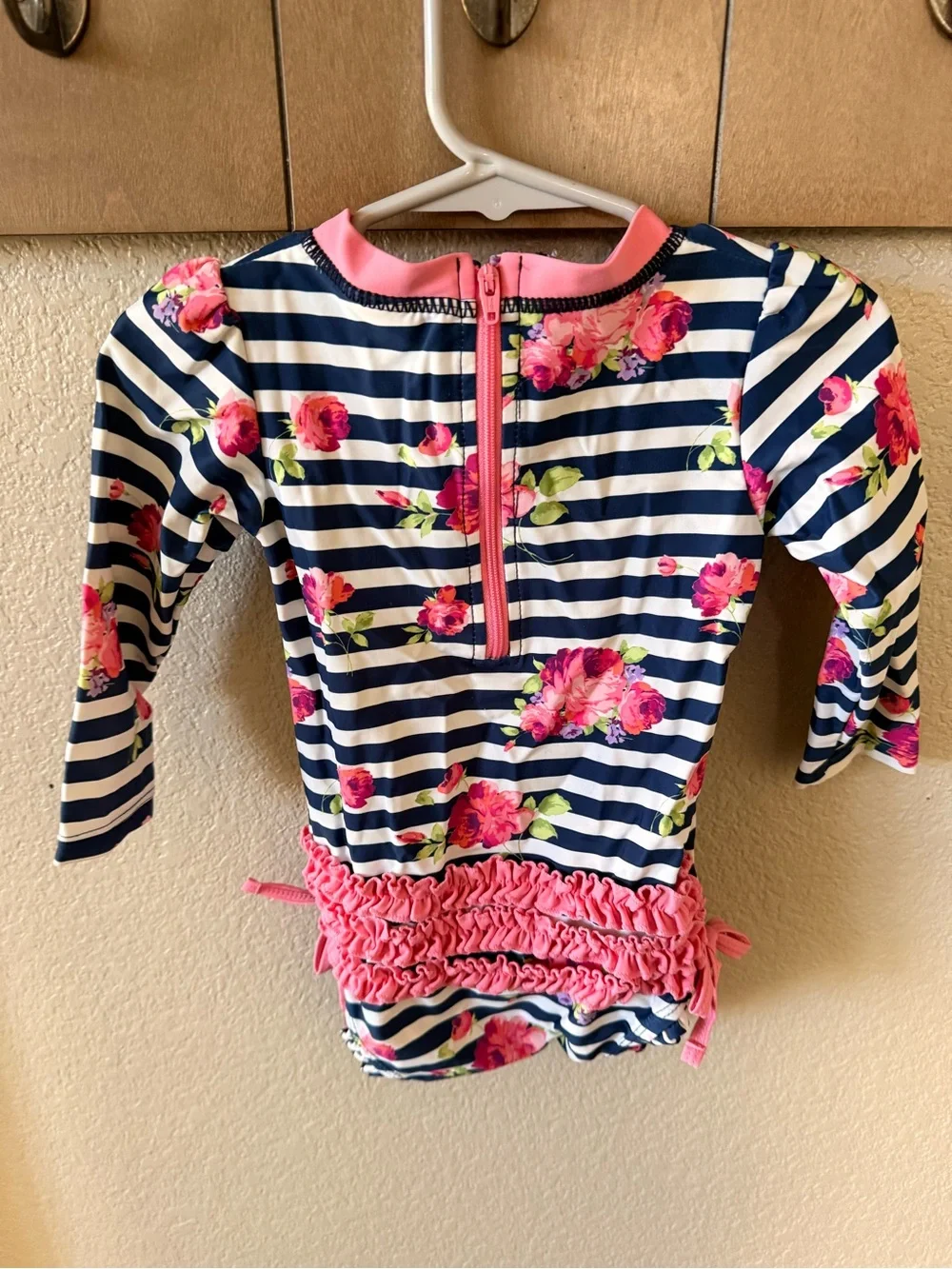 Ruffle Butts Navy & White Stripe Rash Guard with Pink Trim and Floral Accents